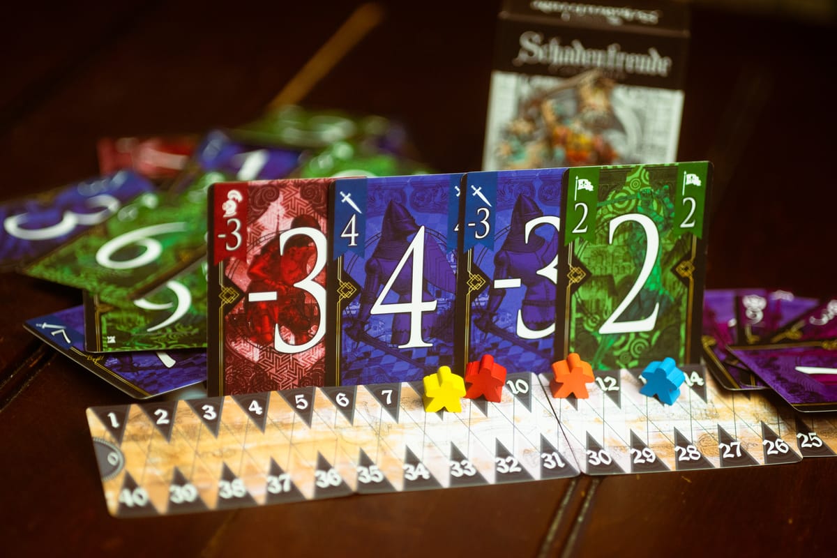 Schadenfreude is a surprising trick-taking game worth the pain