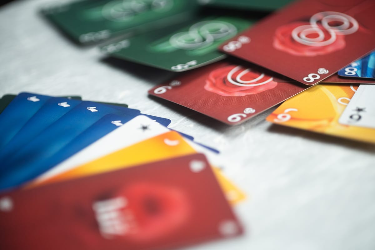 The card game Luz on a table, with card fronts and backs both visible.